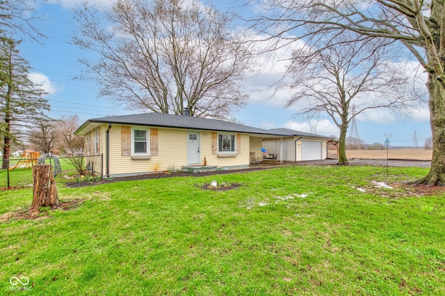 ranch-style house featuring a garage, a front lawn, and fence