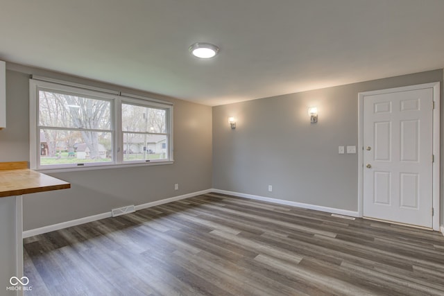 2205 Lafayette Rd, Crawfordsville, IN 47933 - interior space featuring baseboards, wood finished floors, and visible vents