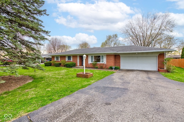 2205 Lafayette Rd, Crawfordsville, IN 47933 - ranch-style house with a garage, driveway, fence, a front yard, and brick siding