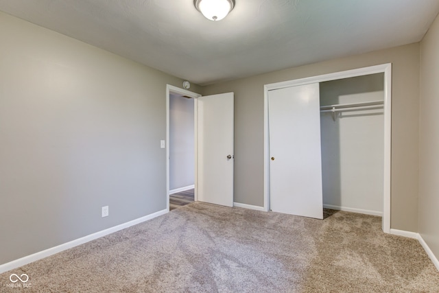 2205 Lafayette Rd, Crawfordsville, IN 47933 - unfurnished bedroom with baseboards, a closet, and carpet