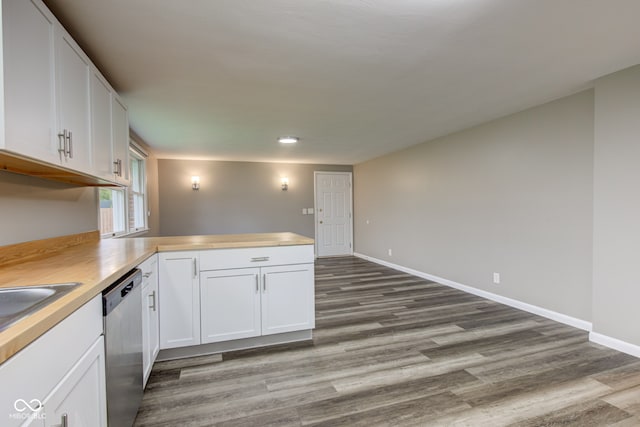 2205 Lafayette Rd, Crawfordsville, IN 47933 - kitchen with a peninsula, stainless steel dishwasher, white cabinetry, and wood finished floors