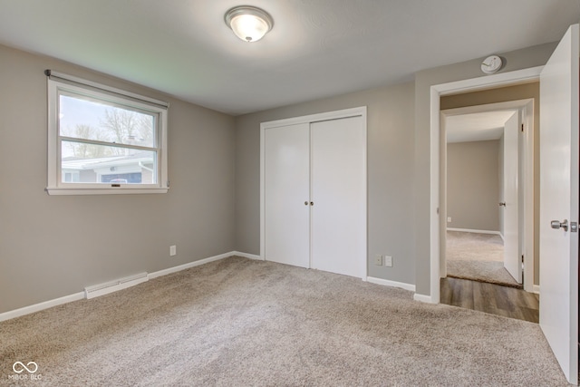 2205 Lafayette Rd, Crawfordsville, IN 47933 - unfurnished bedroom featuring baseboards, carpet flooring, and a closet