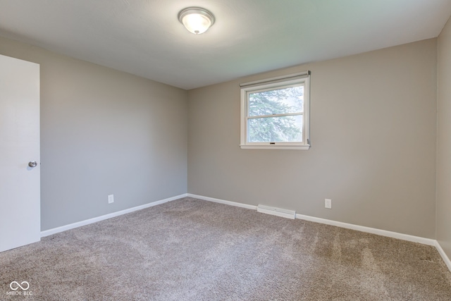 2205 Lafayette Rd, Crawfordsville, IN 47933 - spare room with carpet, visible vents, and baseboards