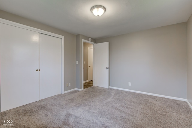 2205 Lafayette Rd, Crawfordsville, IN 47933 - unfurnished bedroom with baseboards, carpet, and a closet