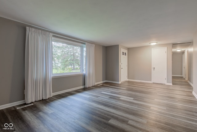 2205 Lafayette Rd, Crawfordsville, IN 47933 - unfurnished living room with wood finished floors, visible vents, and baseboards