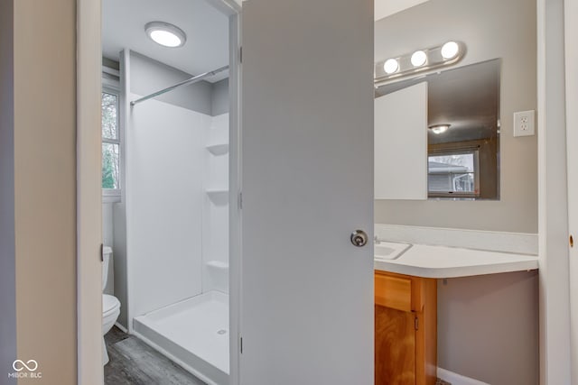 2205 Lafayette Rd, Crawfordsville, IN 47933 - bathroom with toilet, walk in shower, vanity, and wood finished floors