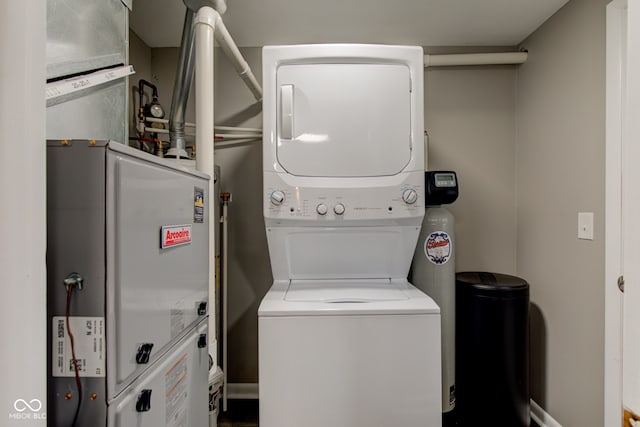 2205 Lafayette Rd, Crawfordsville, IN 47933 - laundry area with water heater, stacked washing maching and dryer, and laundry area