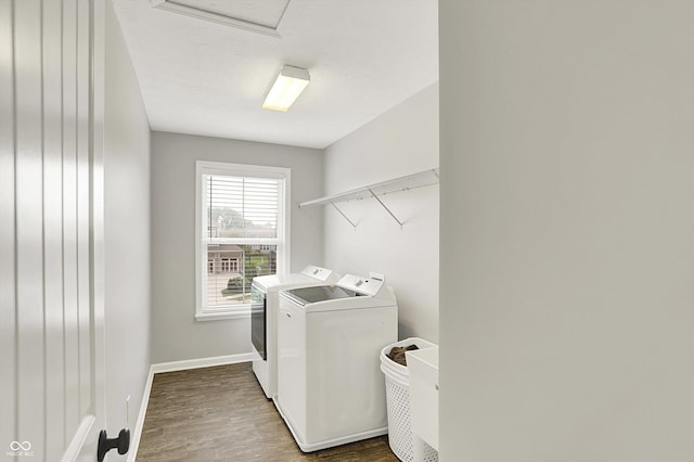 16491 Wheatley Ct, Fishers, IN 46040 - laundry room with independent washer and dryer, wood finished floors, and baseboards