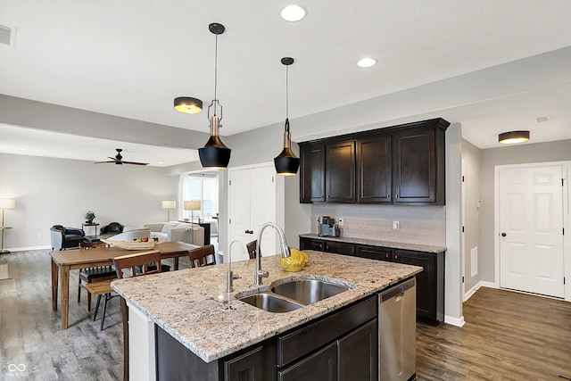 16491 Wheatley Ct, Fishers, IN 46040 - kitchen featuring a sink, stainless steel dishwasher, dark wood-style floors, a ceiling fan, and open floor plan