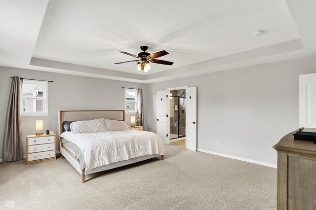 16491 Wheatley Ct, Fishers, IN 46040 - bedroom featuring a tray ceiling, light carpet, baseboards, and ceiling fan
