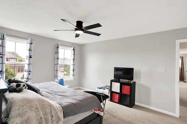 16491 Wheatley Ct, Fishers, IN 46040 - bedroom featuring baseboards, carpet flooring, multiple windows, and a ceiling fan