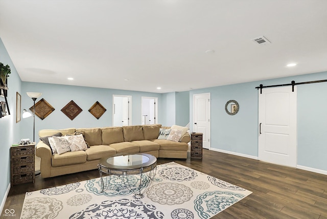 16491 Wheatley Ct, Fishers, IN 46040 - living room featuring a barn door, dark wood-type flooring, recessed lighting, and baseboards