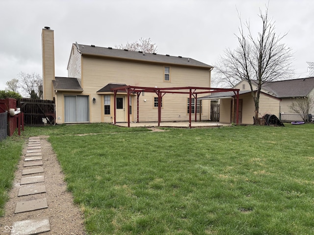 back of house with a lawn, a pergola, fence, and a patio