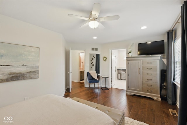 bedroom featuring recessed lighting, ensuite bathroom, dark wood finished floors, and visible vents