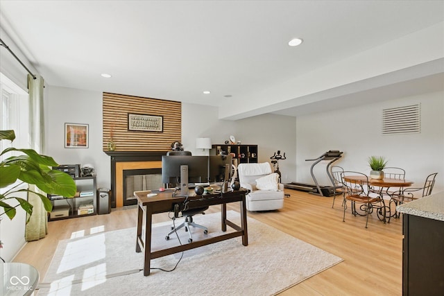office space featuring recessed lighting, visible vents, and light wood-type flooring