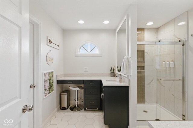 full bathroom featuring vanity, baseboards, recessed lighting, tile patterned floors, and a shower stall