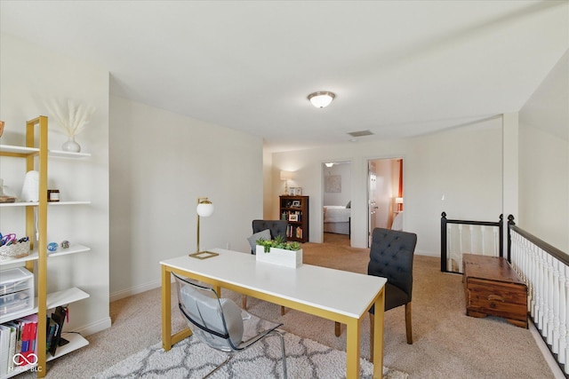 office featuring visible vents and light carpet