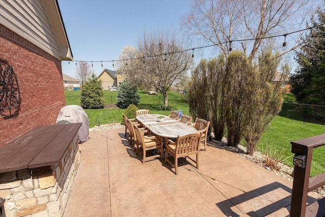 view of patio with fence and outdoor dining space