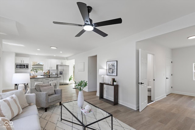 625 N Parker Ave, Indianapolis, IN 46201 - living area with light wood-type flooring, baseboards, a ceiling fan, and recessed lighting