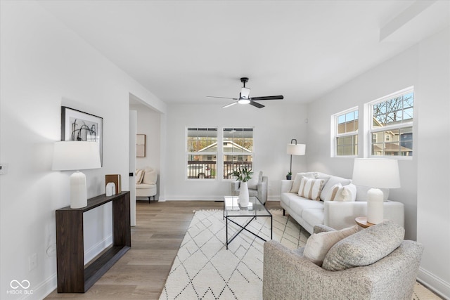 625 N Parker Ave, Indianapolis, IN 46201 - living area featuring a ceiling fan, light wood finished floors, and baseboards