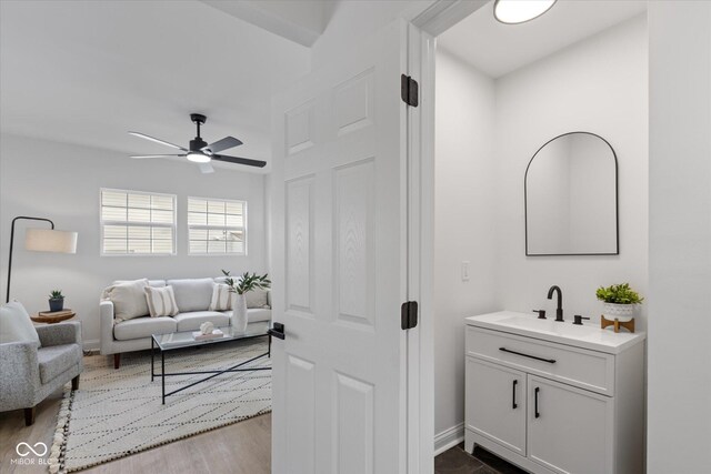 625 N Parker Ave, Indianapolis, IN 46201 - bathroom featuring ceiling fan, wood finished floors, vanity, and baseboards