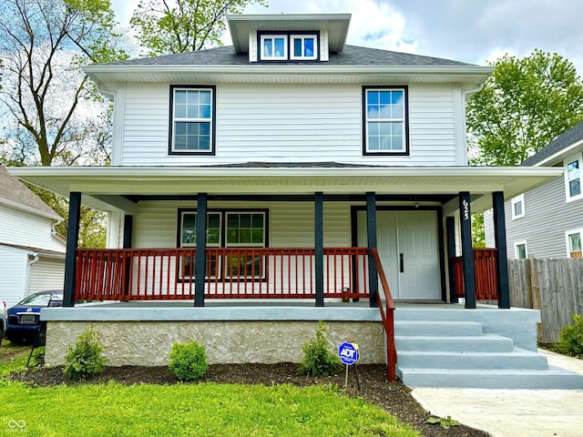 625 N Parker Ave, Indianapolis, IN 46201 - american foursquare style home with covered porch, fence, and roof with shingles