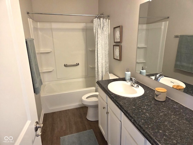 full bathroom featuring shower / tub combo with curtain, wood finished floors, vanity, and toilet