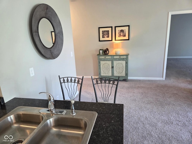 dining room with baseboards and carpet flooring