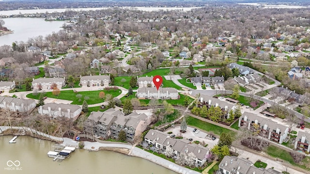 birds eye view of property with a residential view and a water view