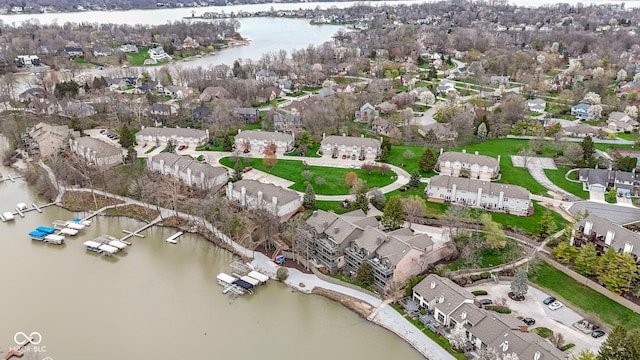 drone / aerial view with a residential view and a water view