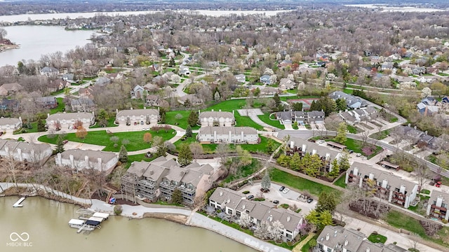 drone / aerial view featuring a water view and a residential view