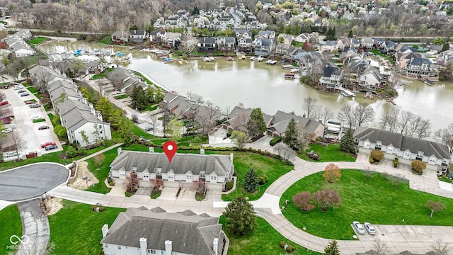 bird's eye view with a residential view and a water view