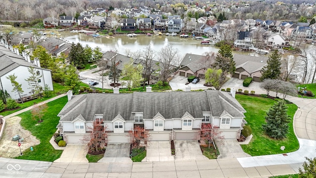 aerial view featuring a residential view and a water view