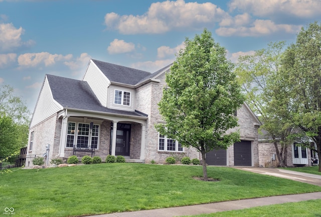 view of front facade with fence, a front lawn, brick siding, a garage, and concrete driveway