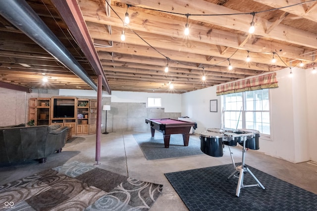 game room with plenty of natural light, billiards, and unfinished concrete flooring