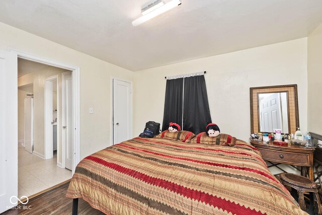 bedroom featuring wood finished floors