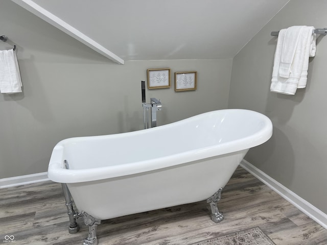 4205 Rookwood Ave, Indianapolis, IN 46208 - full bath with a freestanding tub, baseboards, and wood finished floors