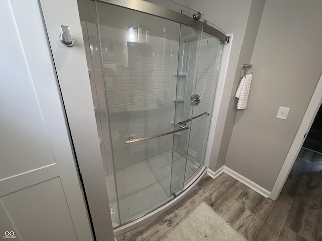 4205 Rookwood Ave, Indianapolis, IN 46208 - full bath with a shower stall, baseboards, and wood finished floors