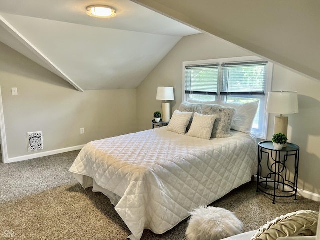 4205 Rookwood Ave, Indianapolis, IN 46208 - carpeted bedroom with baseboards, lofted ceiling, and visible vents