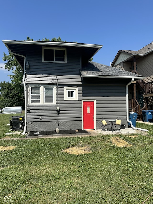 4205 Rookwood Ave, Indianapolis, IN 46208 - exterior space with central air condition unit, a patio, and a front lawn