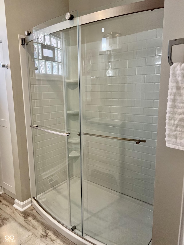 4205 Rookwood Ave, Indianapolis, IN 46208 - full bath featuring a stall shower and wood finished floors