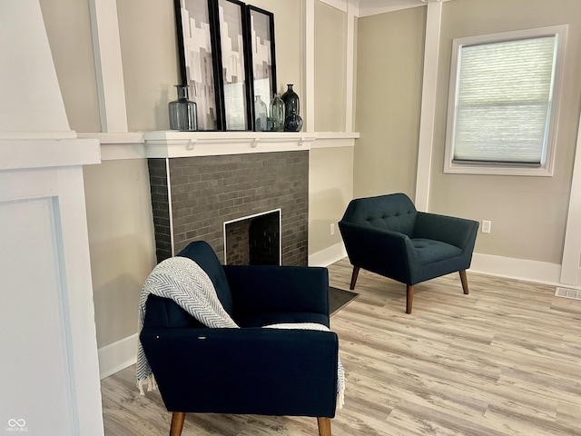 4205 Rookwood Ave, Indianapolis, IN 46208 - sitting room with a fireplace, visible vents, baseboards, and wood finished floors