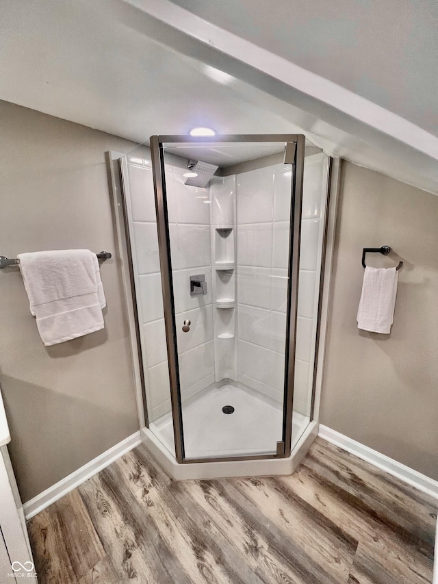 4205 Rookwood Ave, Indianapolis, IN 46208 - full bathroom featuring baseboards, a stall shower, and wood finished floors