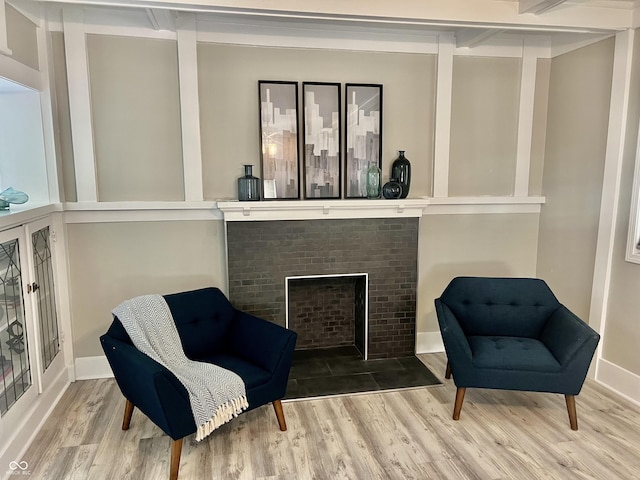 4205 Rookwood Ave, Indianapolis, IN 46208 - sitting room with a fireplace with flush hearth, baseboards, and wood finished floors
