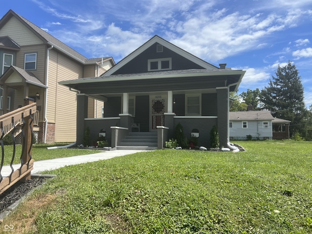4205 Rookwood Ave, Indianapolis, IN 46208 - view of front of house with a front yard and a porch
