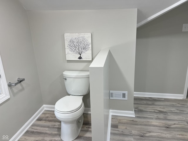 4205 Rookwood Ave, Indianapolis, IN 46208 - bathroom featuring toilet, wood finished floors, baseboards, and visible vents