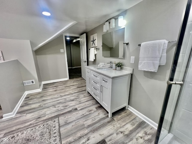 4205 Rookwood Ave, Indianapolis, IN 46208 - full bath featuring wood finished floors, vanity, baseboards, and visible vents