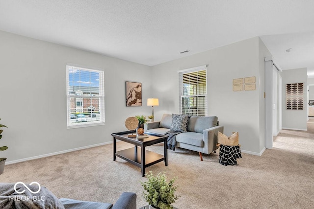 1632 Queensbridge Sq Unit 7, Indianapolis, IN 46219 - living area featuring light carpet and baseboards