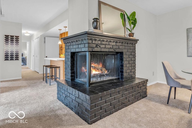 1632 Queensbridge Sq Unit 7, Indianapolis, IN 46219 - detailed view of carpet flooring, a brick fireplace, and baseboards