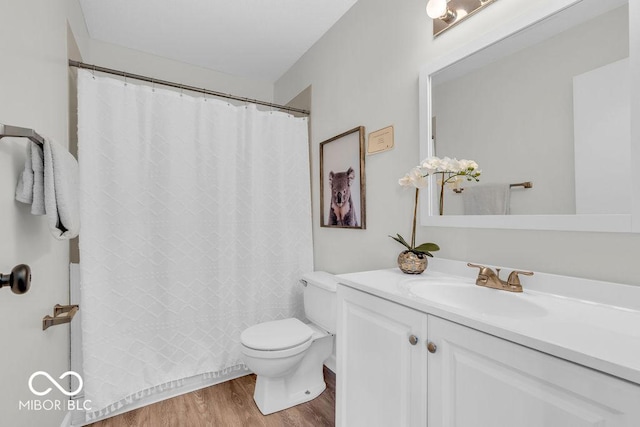 1632 Queensbridge Sq Unit 7, Indianapolis, IN 46219 - full bath with toilet, vanity, wood finished floors, and curtained shower